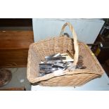 A wicker basket of cutlery