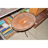 An Edwardian mahogany oval tray raised on tripod s