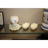 A pair of Belleek china salt cellars; and a Royal