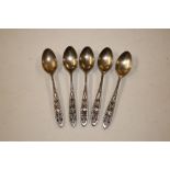 Five continental white metal coffee spoons with fi