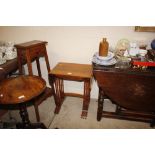 A nest of three mahogany occasional tables