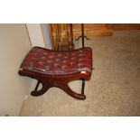 A mahogany and red leather button down stool