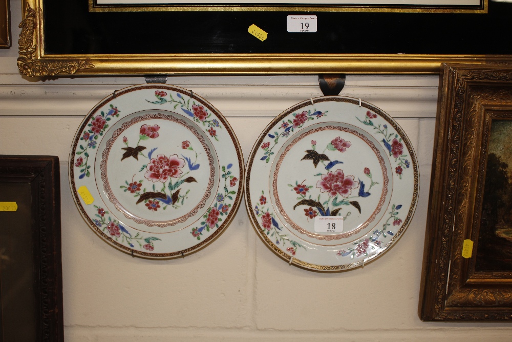 A pair of 19th Century china floral decorated plat