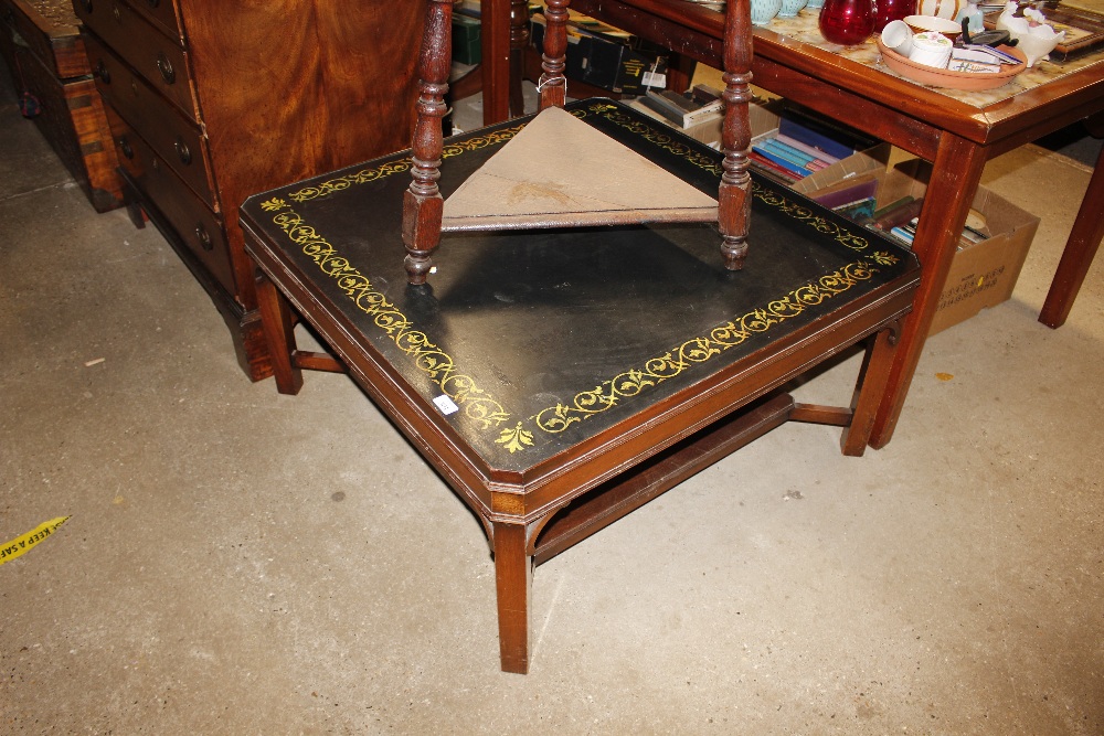 A mahogany square coffee table with painted top