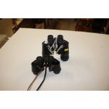 A pair of Dolland of London binoculars; and a pair