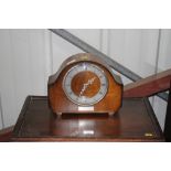 A walnut cased mantel clock with presentation insc