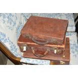 Two brown leather suitcases; and a brown leather b