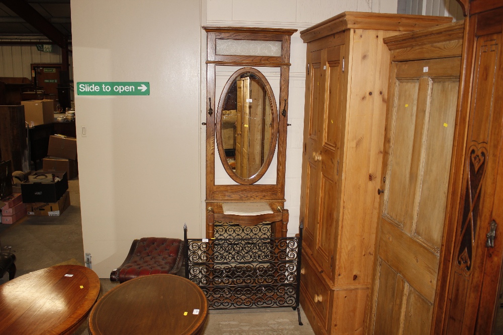 An oak and mirrored hall stand