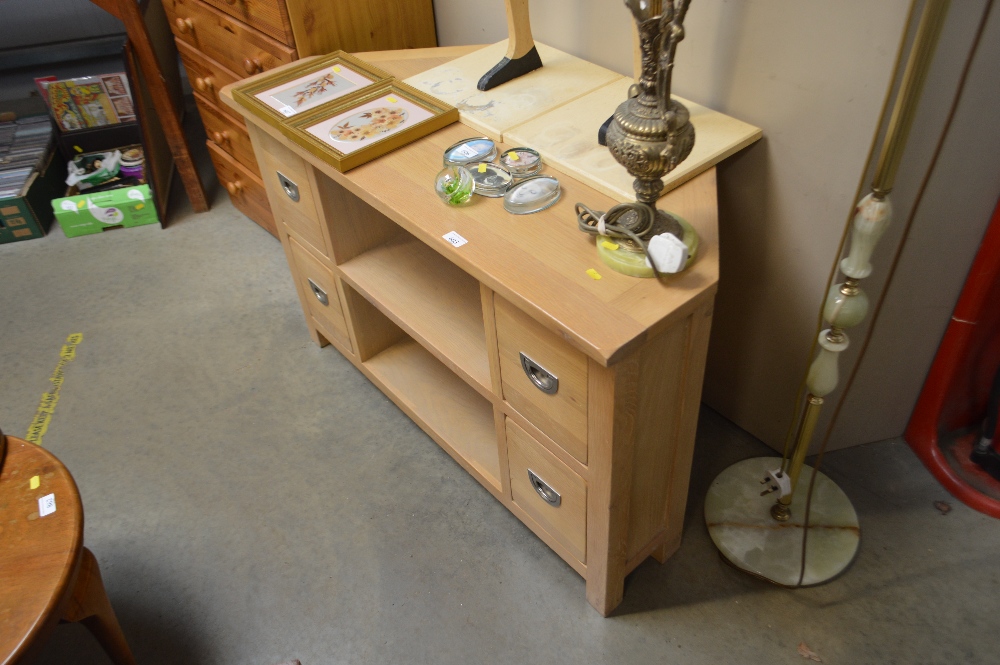 A light oak effect TV stand