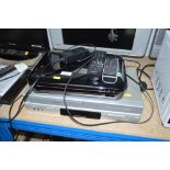 A Toshiba DVD player and video cassette recorder;