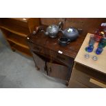 A walnut cupboard fitted single drawer