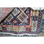 An approx 5'5" x 4' modern Eastern patterned rug
