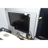 A Technosonic flat screen TV with remote control