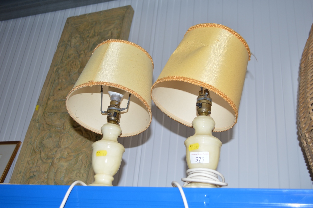 A pair of alabaster table lamps and shades