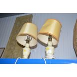 A pair of alabaster table lamps and shades
