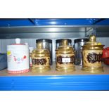 Three brass storage jars; and five others