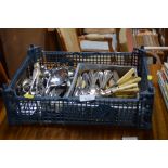 A crate of various cutlery