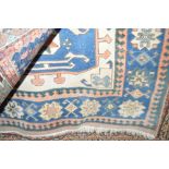 An approx 7'4" x 4'9" Eastern blue patterned rug