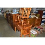 A teak drop leaf table; together with three pine c