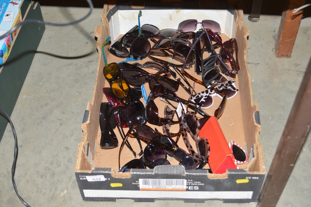 A box of various lady's sunglasses