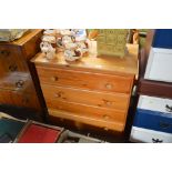 A modern pine chest fitted four long drawers