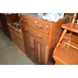 A teak tallboy fitted two drawers