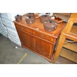 A reproduction yew wood cupboard fitted two drawer