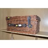 A wicker picnic hamper lacking contents