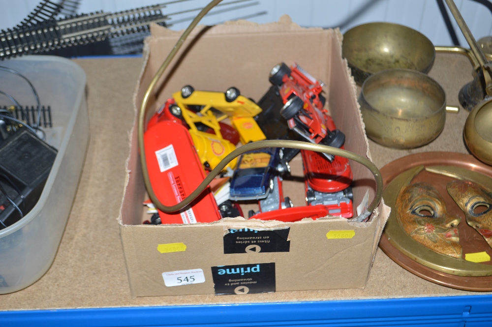 A box of various Ferrari model cars