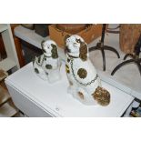 A pair of Staffordshire style dog ornaments with g