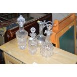 Three decanters and stoppers; together with a clar