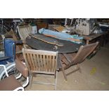 A teak garden table with lazy Susan; with six chai