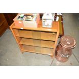 A walnut bookcase with glass sliding doors