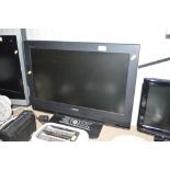 A Toshiba flat screen television with remote contr