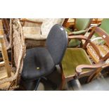 A black upholstered swivel office chair