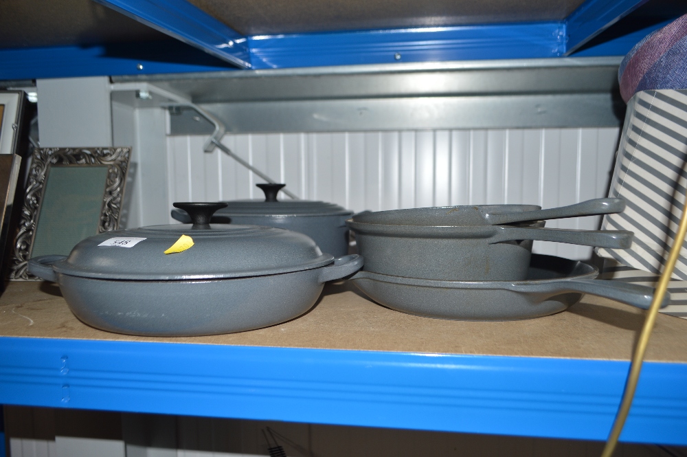 A quantity of Le Creuset cooking dishes