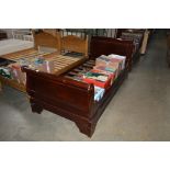 A mahogany sleigh bed