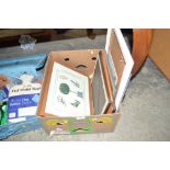 A box containing various pictures and prints