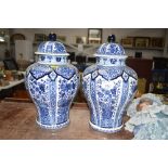 A pair of blue and white vases