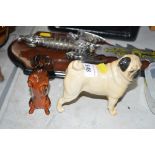 A Beswick ornament in the form of a pug; together