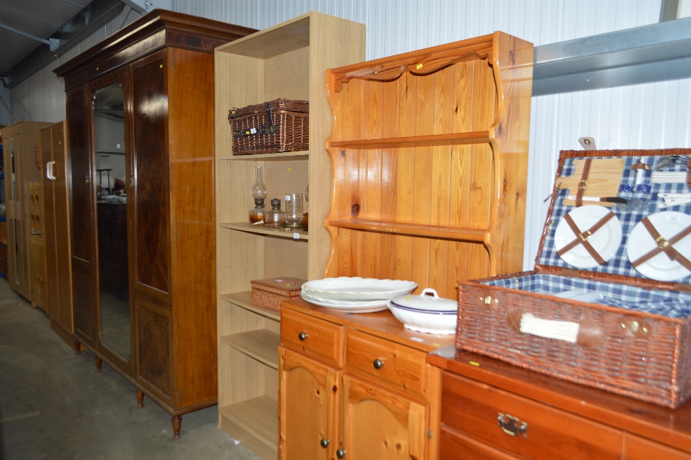 A modern pine dresser raised on cupboard base fitt