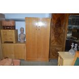 A veneered two door wardrobe