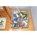 A box containing various keys and key rings etc