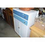 A painted tallboy fitted two drawers