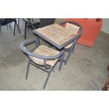 A metal and wooden bistro set