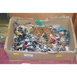 A box of various costume jewellery