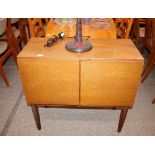 A teak Tapley 33 side cabinet, enclosed by a pair