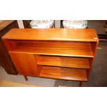 A teak side cabinet, open recess above cupboard an