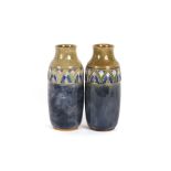 A pair of Doulton stone ware baluster vases, havin