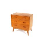 A G-plan teak chest fitted three long drawers, rai